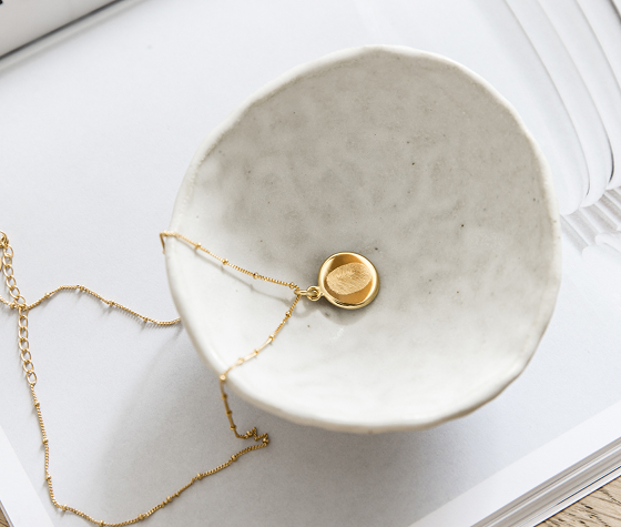 A necklace in a bowl