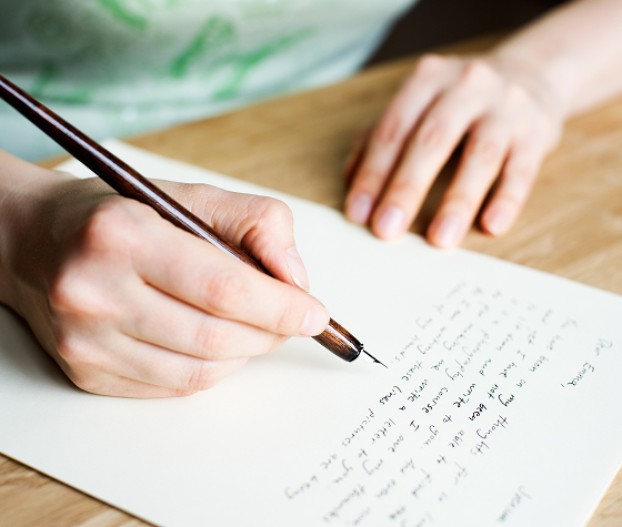 A person writing on paper