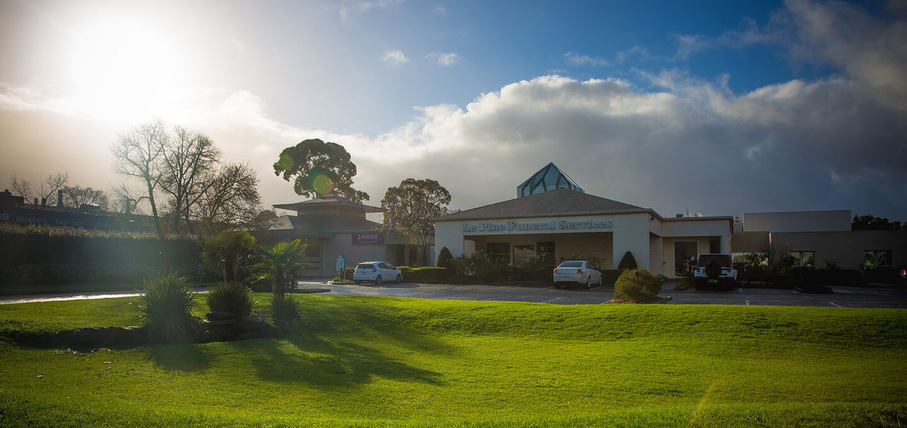 Image of a landscape with a garden and Le Pine location in the background