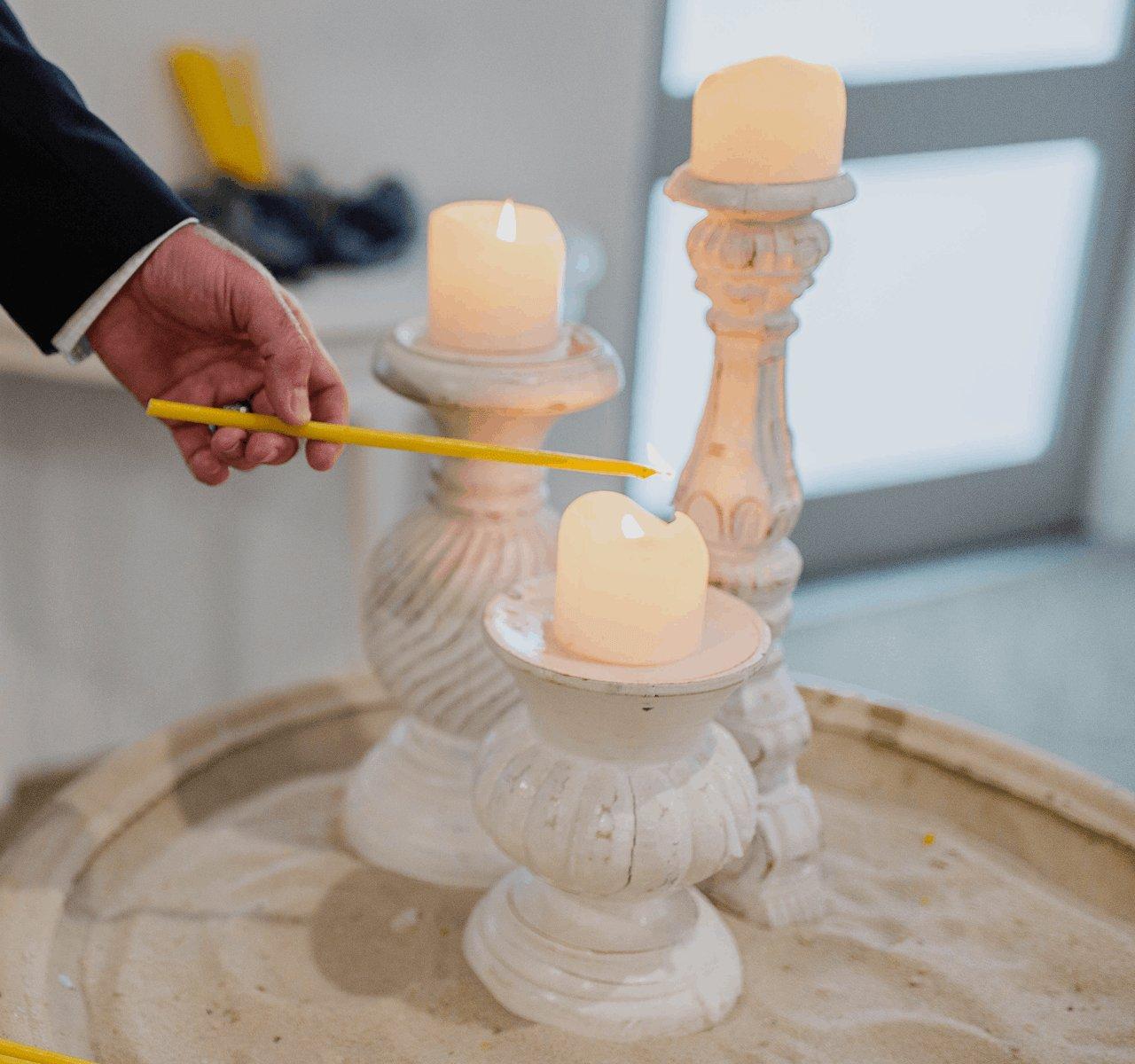 An image of a person burning candles
